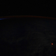 El punto naranja en la foto es el resplandor de la lava desde el espacio.